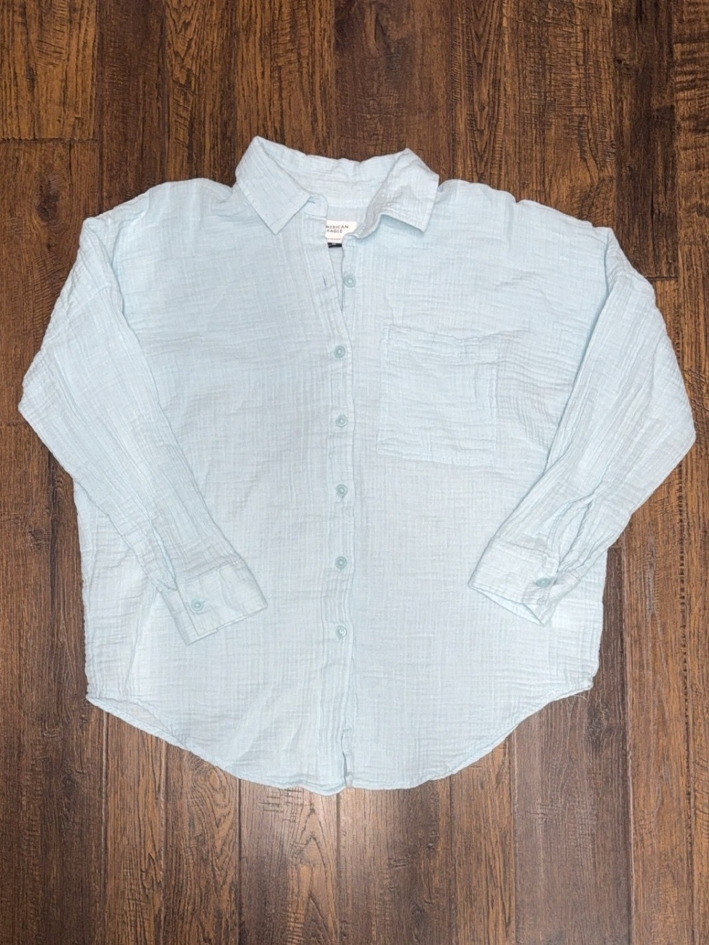 Ladies American eagle light blue gauze button up shirt